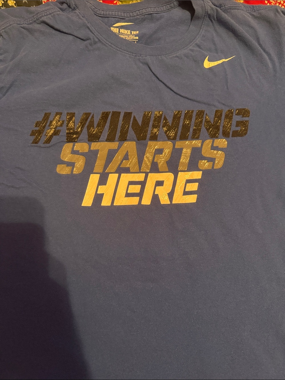Nike Navy T‑Shirt with Gold Slogan